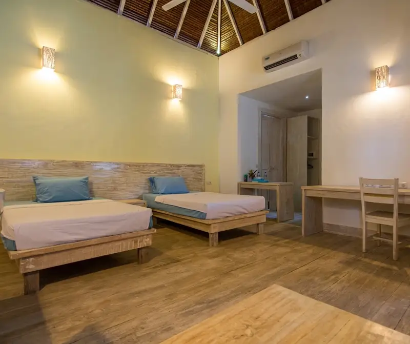 Bright and modern Garden View Room interior with whitewashed walls.