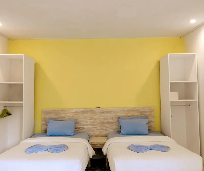 Comfortable bedroom area designed for relaxation after a day of macro diving.