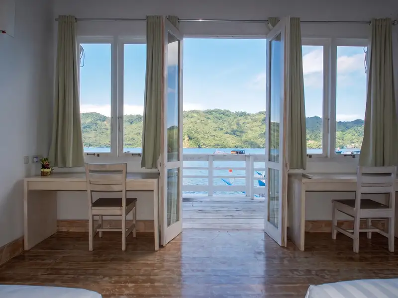 Private balcony offering stunning ocean views of the Lembeh Strait.